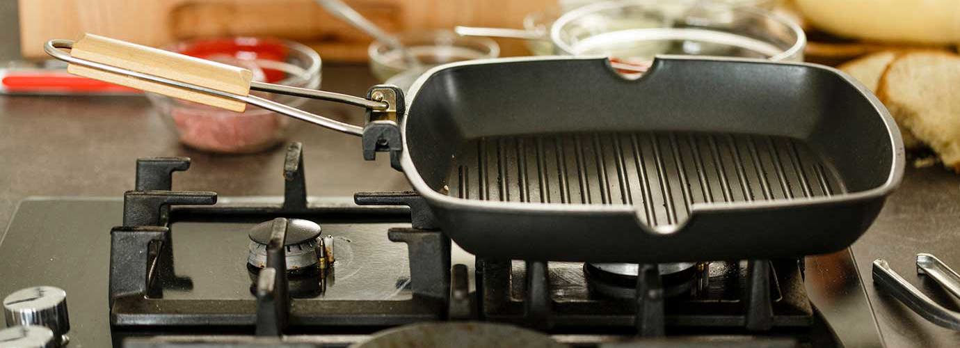Empty clean griddle on gas stove